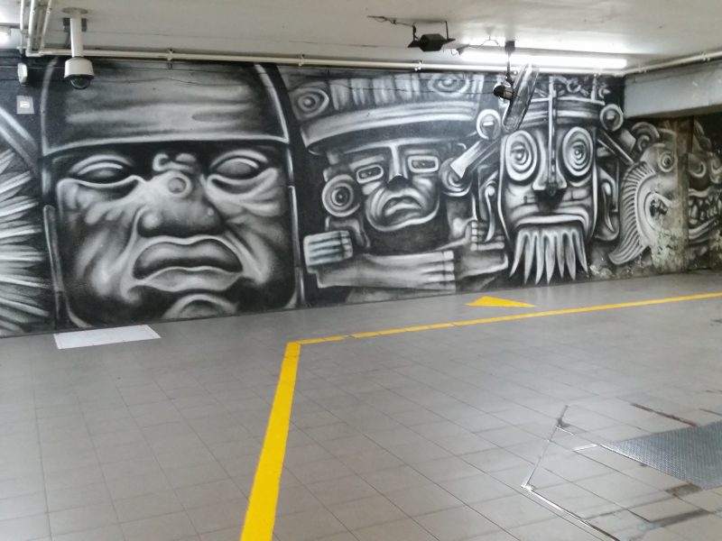 An mural of Olmec heads in the Bellas Artes Metro Station in Mexico City.