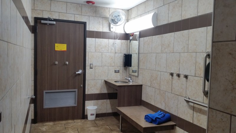 The interior of a private shower stall at Love's Truck Stop, one of the best palces to get clean while living van life.