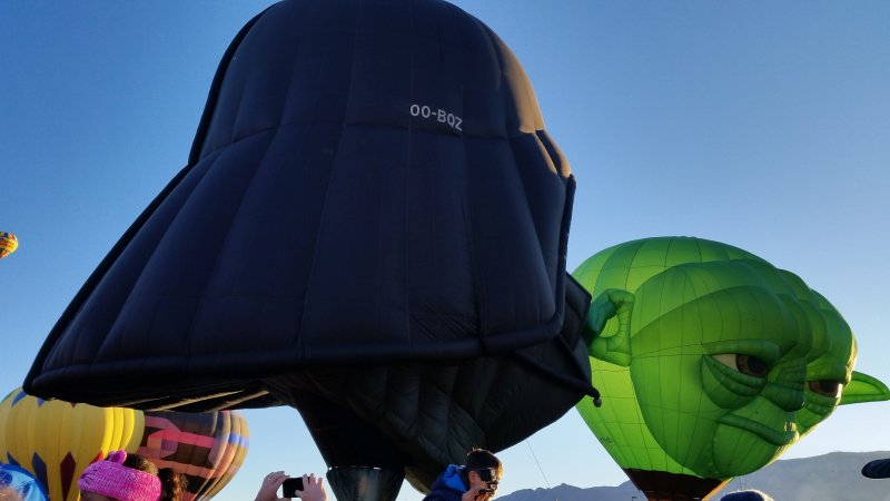 Close up of Yoda and Darth Vader special shape hot air balloons at the Albuquerque. International Balloon Fiesta