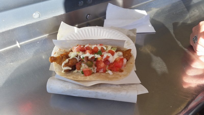 Authentic Baja California fish tacos on a white paper plate in Guerrero Negro, Mexico.