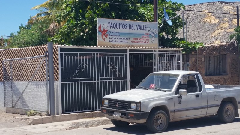 A white truck in front of Taquitos Del Valle in Loreto, Baja Sur, Mexico.