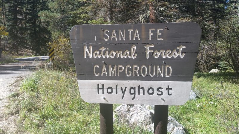 A an official sign for Holy Ghost Campground, part of Santa Fe National Forest in New Mexico.