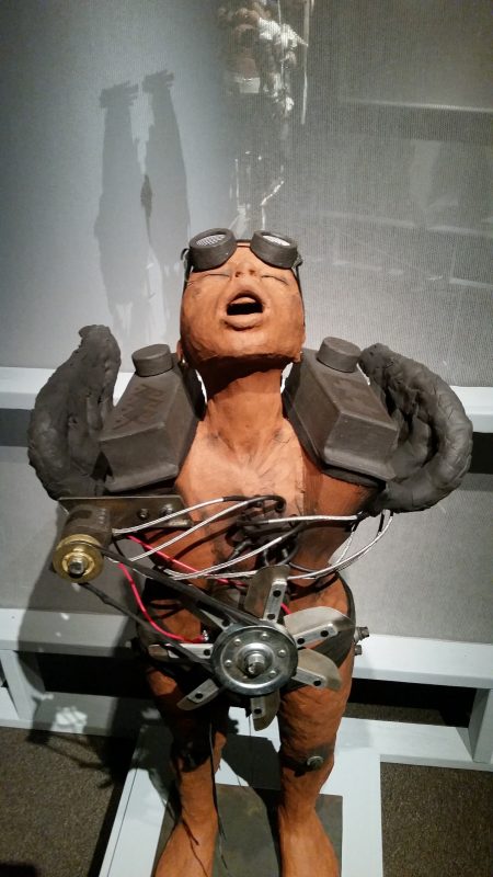 A stylized, industrial-looking terracotta figure from artist Rose B. Simpson on display at Museum hill in Santa Fe.