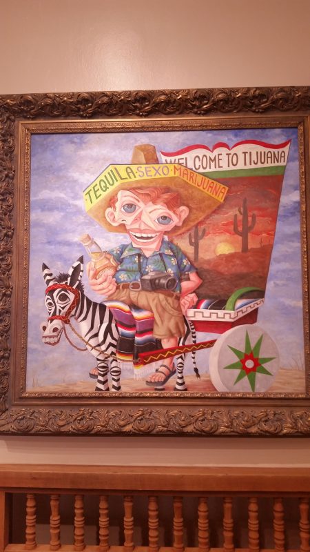 Caricature painting of a drunk U.S. tourist at a museum in Santa Fe, New Mexico.