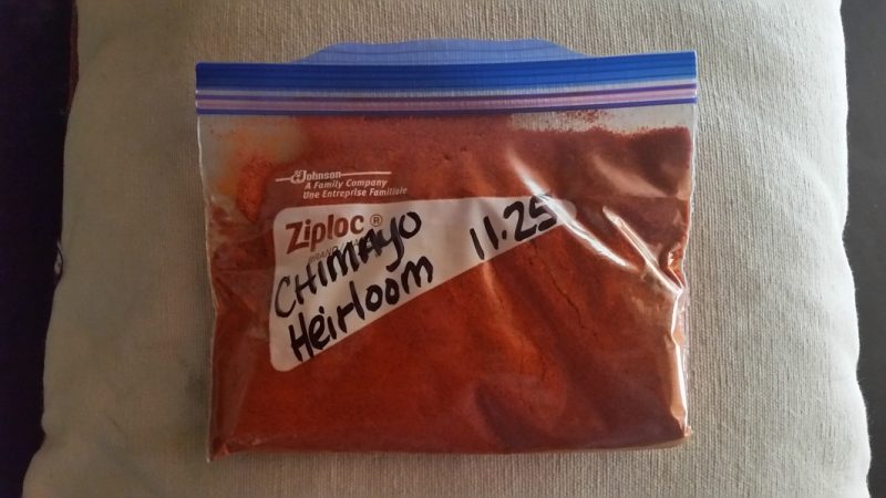 A Ziploc bag of ground red Chimayo chile powder from New Mexico.