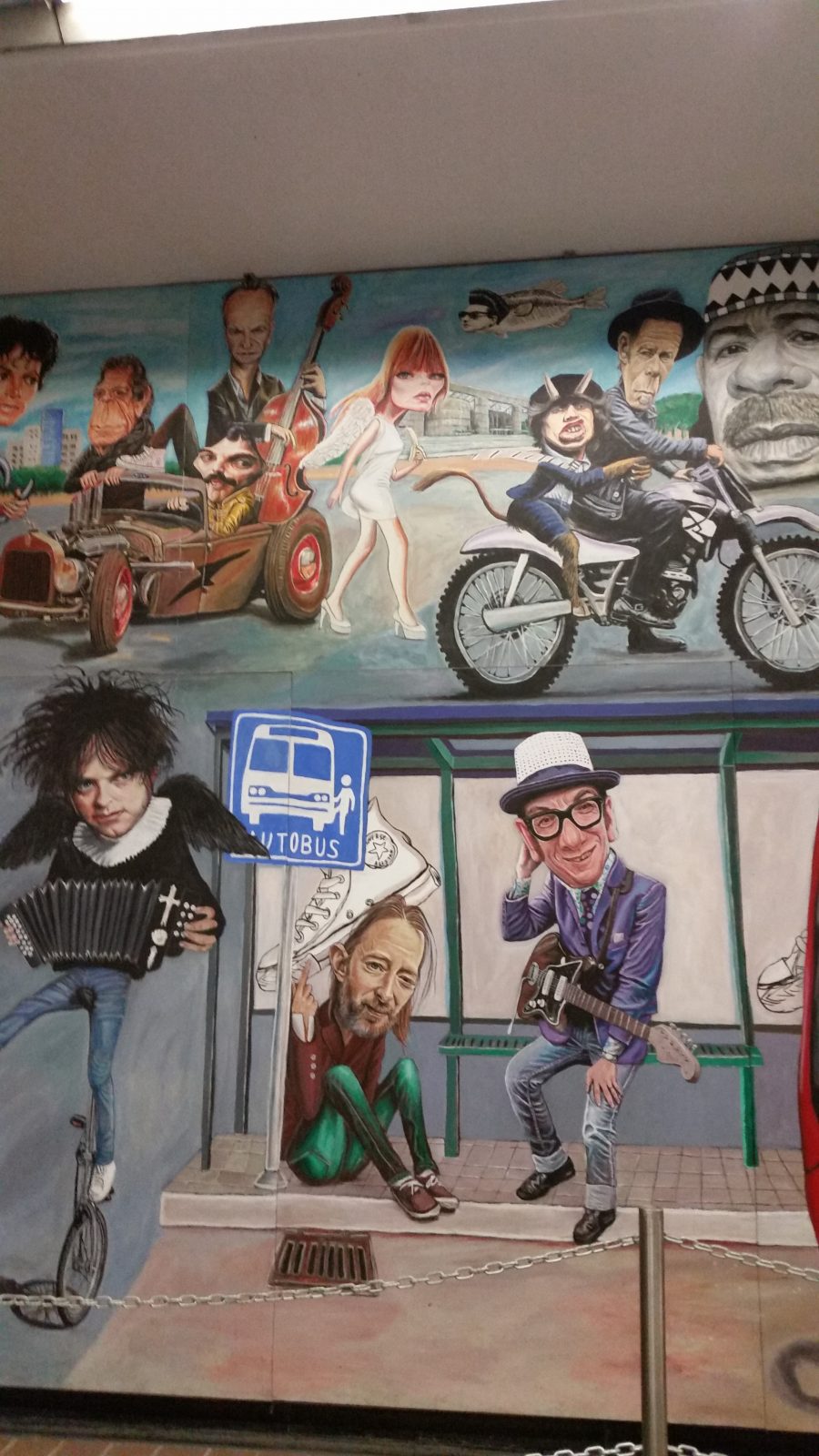 A view of the famous rock 'n roll murals in Auditorio Metro Station in Mexico City painted by artist Jorge Manjarrez showing Robert Smith from The Cure and Elvis Costello.