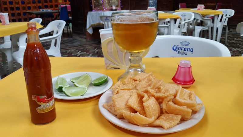 A plate of the botanas known as duras and a mug of beer in a cantina in Mexico City.