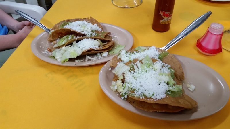 Two plates of tacos doradas served as botanas in a cantina in Mexico City.