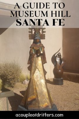 A gold sculpture of a female outside in the courtyard of Museum Hill in Santa Fe.