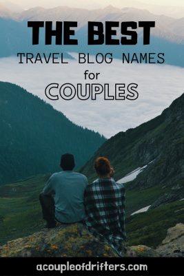couple sitting on mountaintop with view