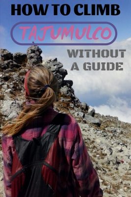 woman standing on top of mountaintop.