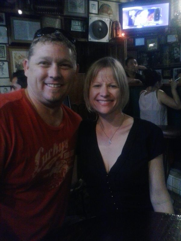 Man and woman posing for a photo in a cantina in Zacatecas, Mexico.