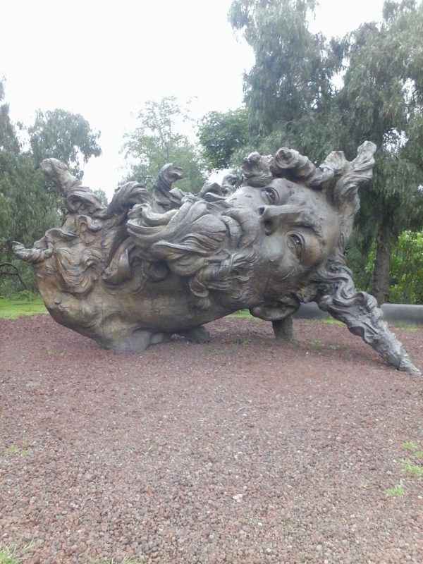 An elaborate sculpture of a head laying on it's side at Anahuacalli in Mexico City.