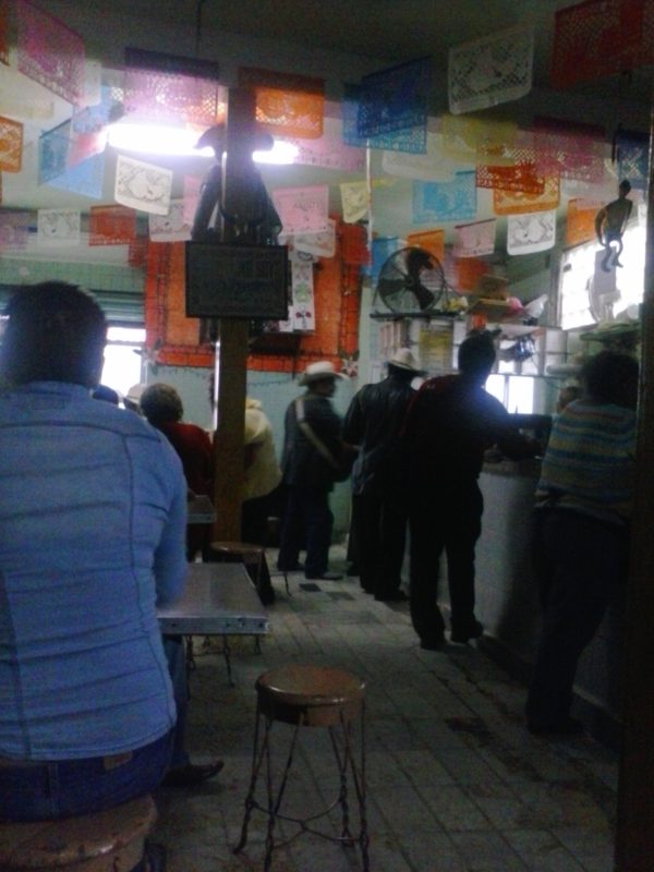 People drinking in a pulqueria in Mexico City.