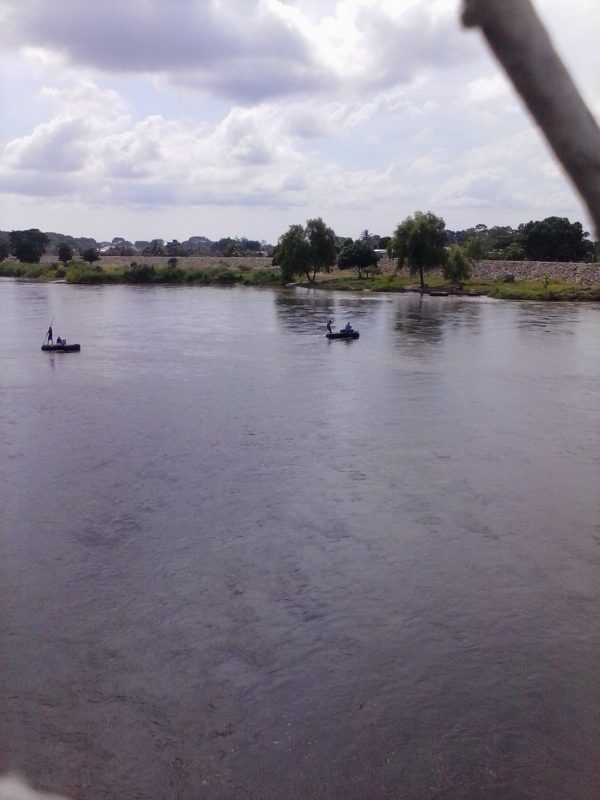 Two makeshift rafts crossing the border river between Mexico and Guatemala.