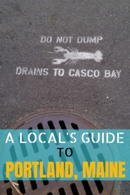 A drainage manhole cover with a lobster stencil in Portland, Maine.