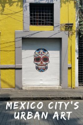 An example of colorful urban artwork of a skull on the streets of Mexico City.
