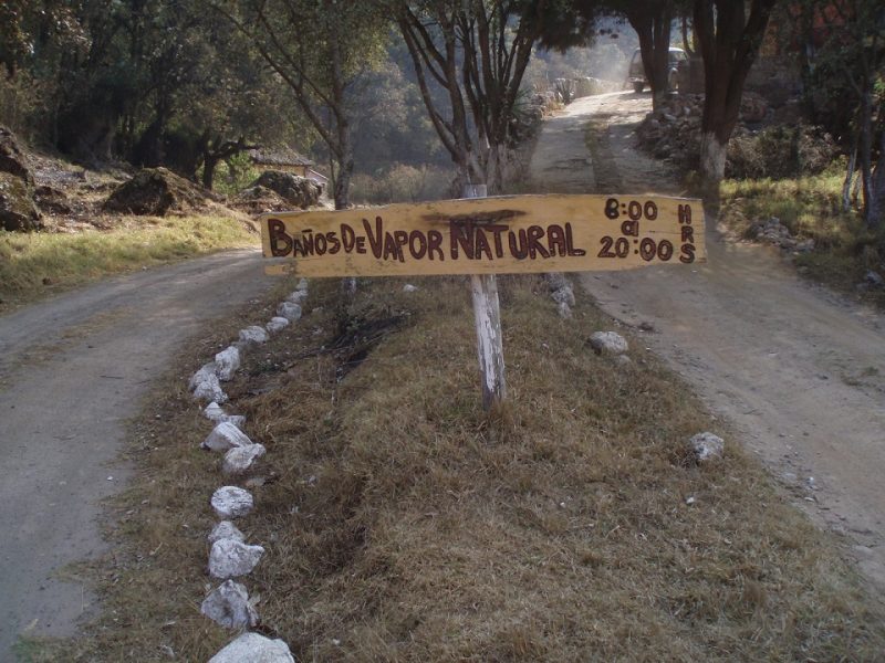 A wooden sign advertising a steam sauna in the mountains of Guatemala.