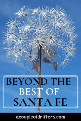 A glass dandelion sculpture in Santa Fe against a blue sky.