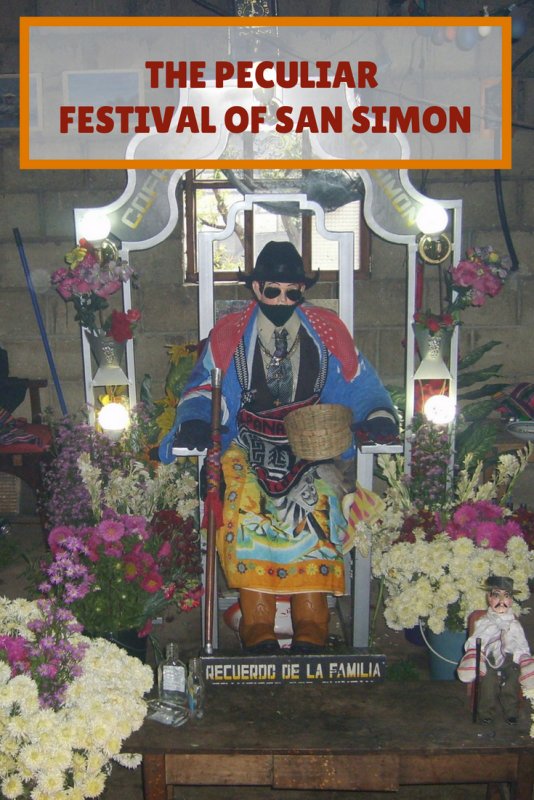 mannequinn seated in chair wearing cowboy hat and sunglasses.