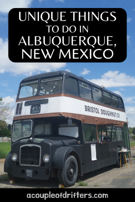 Black and white old British double-decker bus.
